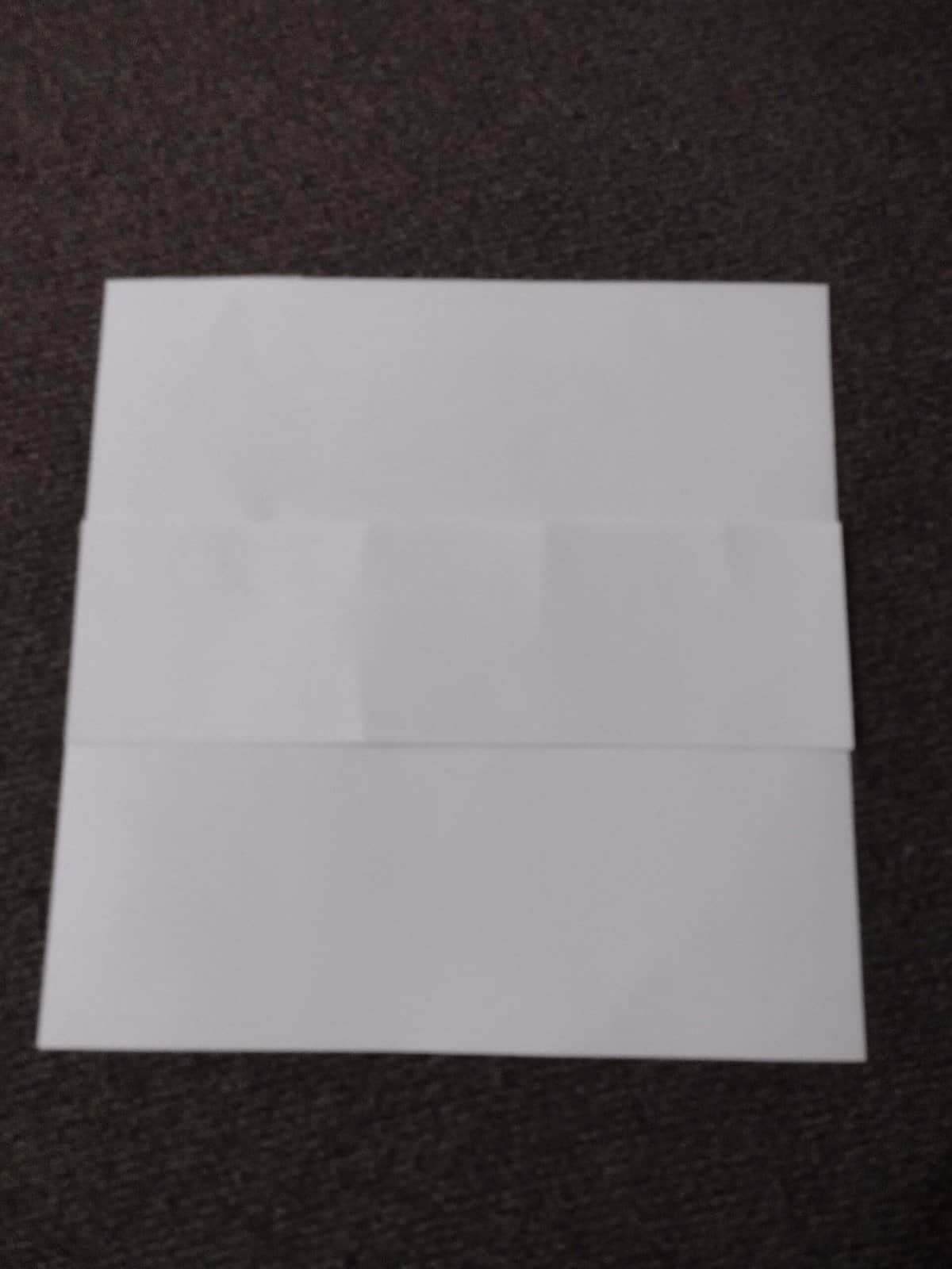 Picture of strip of paper backing a piece of paper