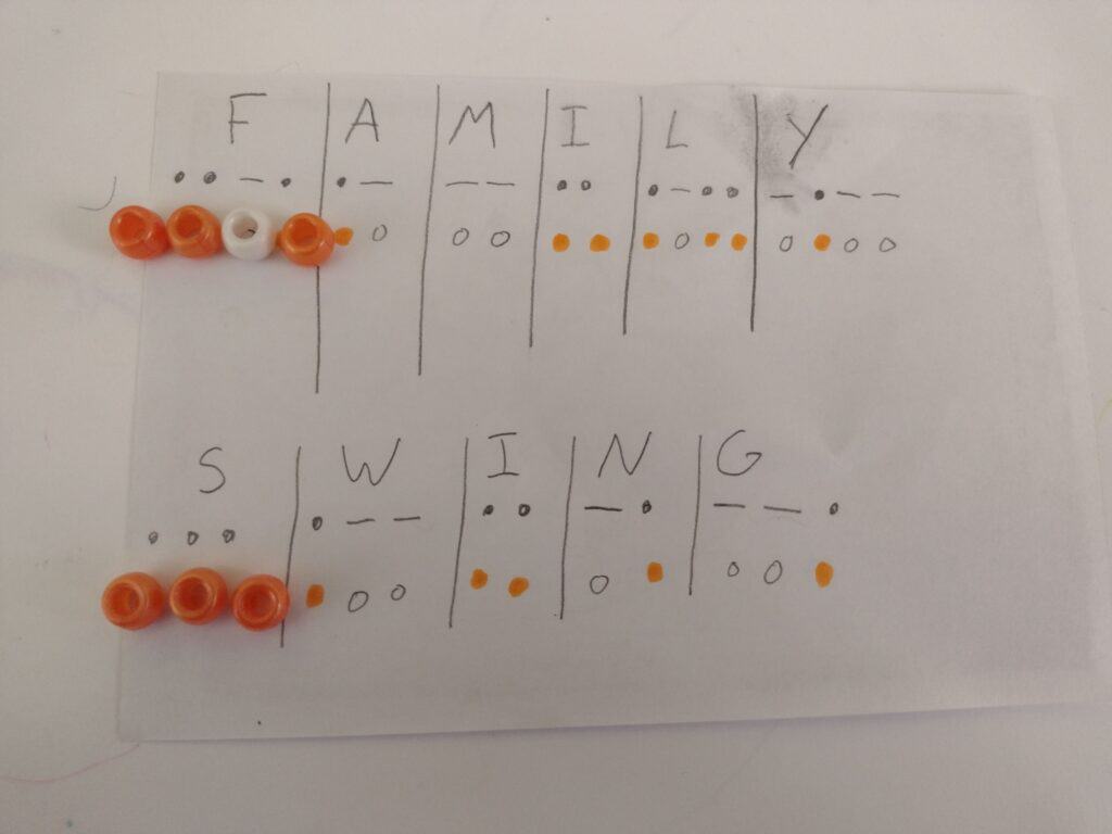 picture of chart translating "family" and "Swing" into Morse code