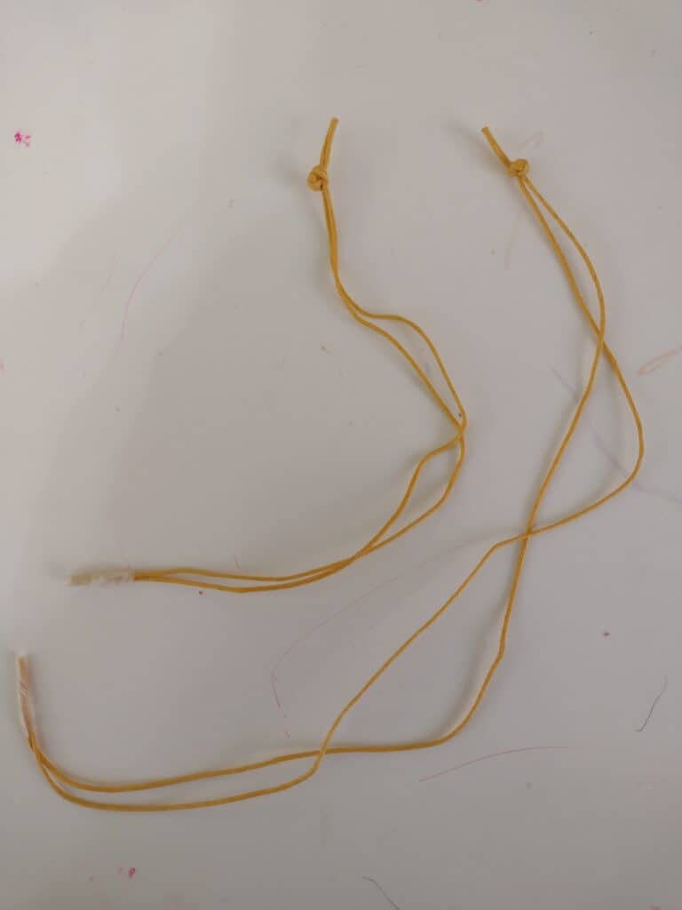 Picture of bracelet cord prepped to make bead bracelets