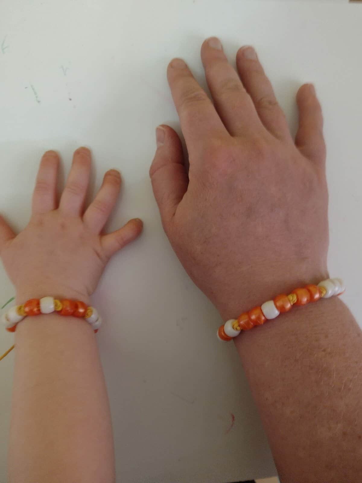 Picture of two Morse code bracelets being worn