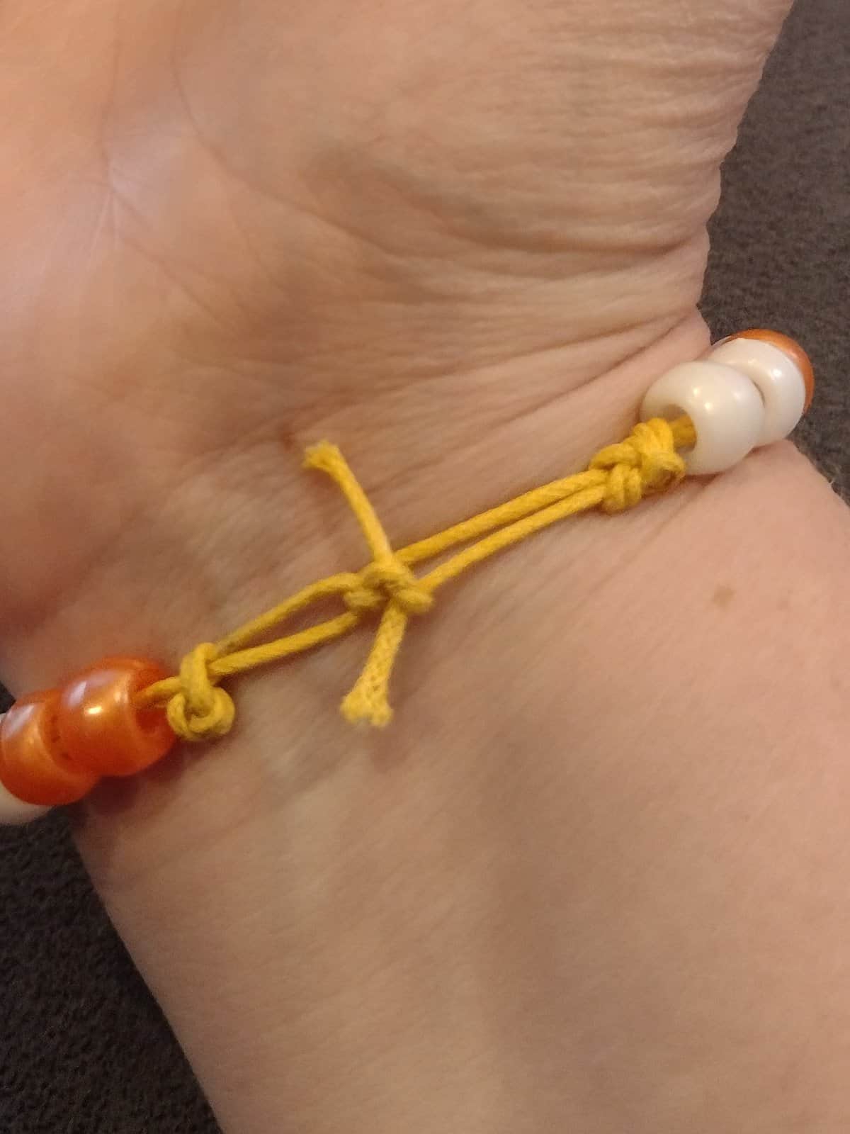 Picture of thankfulness Morse code bracelet tied to wrist