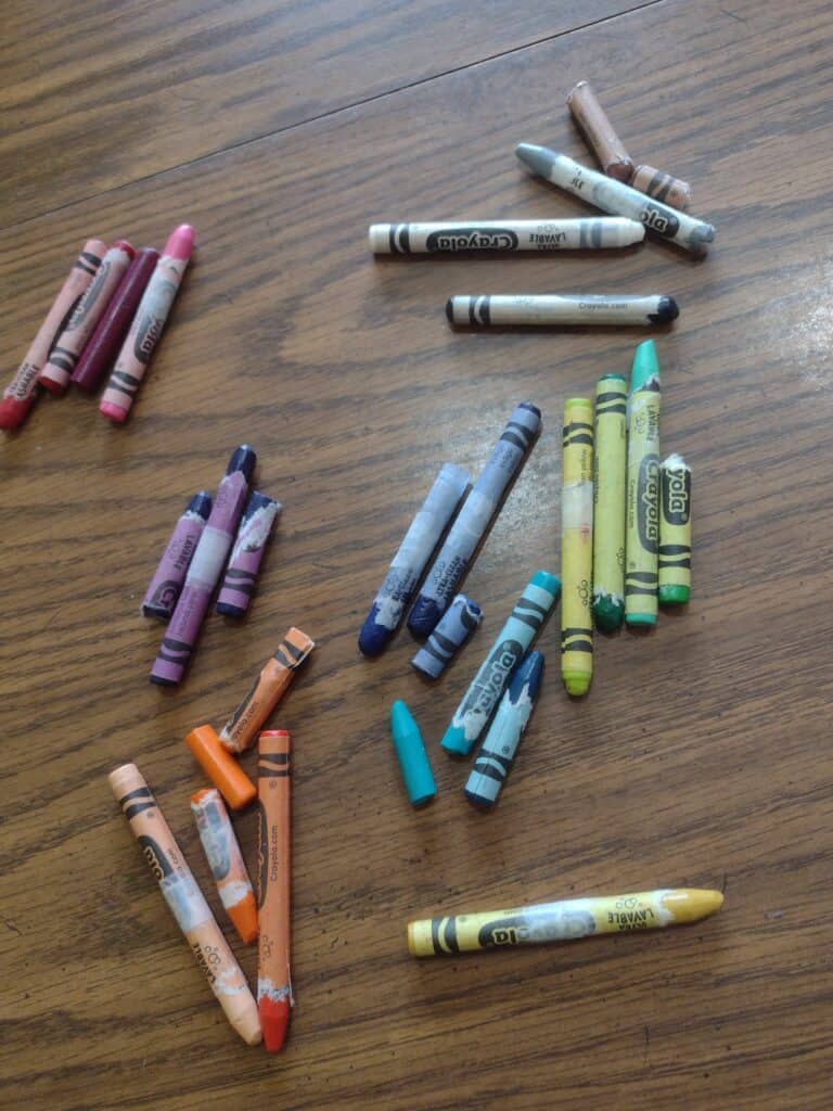 Picture of crayons sorted in piles by color