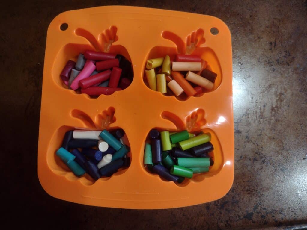Picture of pumpkin silicone mold filled with crayons