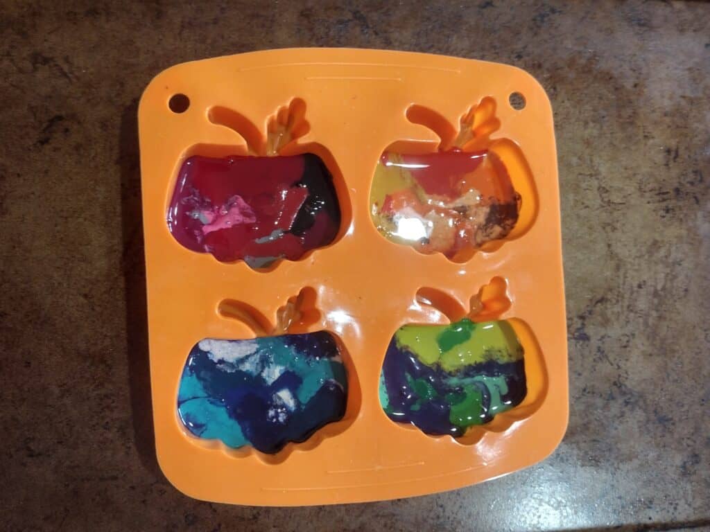 Picture of pumpkin silicone mold after melting crayon in the oven