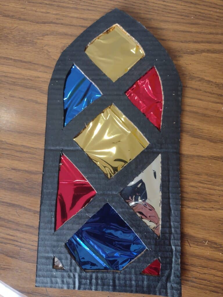 Picture of a stained glass window craft for a dragon and knight party