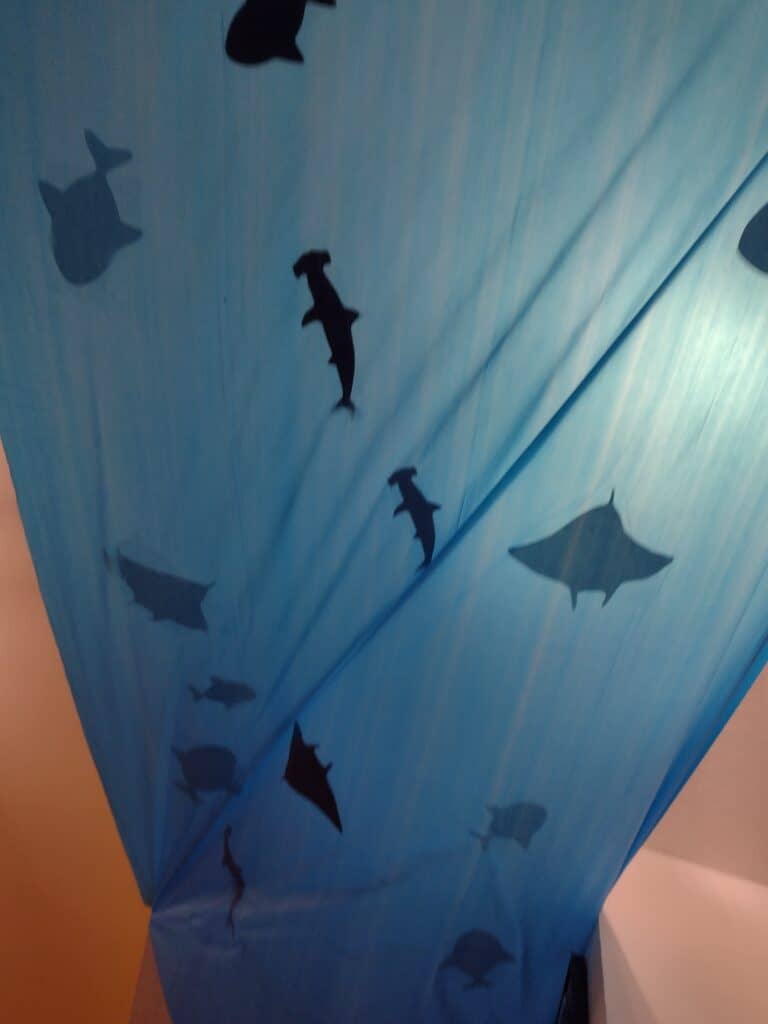 View of fish silhouette party decoration from underneath