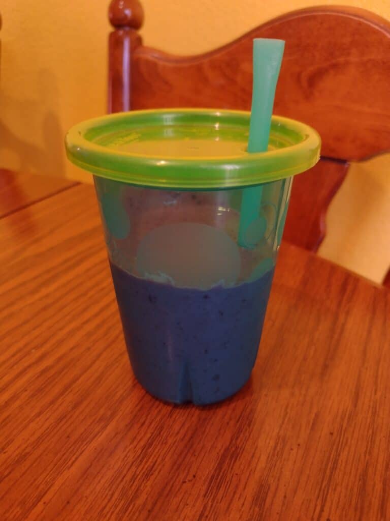 Picture of a plastic cup full of smoothie