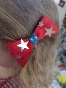 Picture of a 4th of July hair bow in a toddler's hair