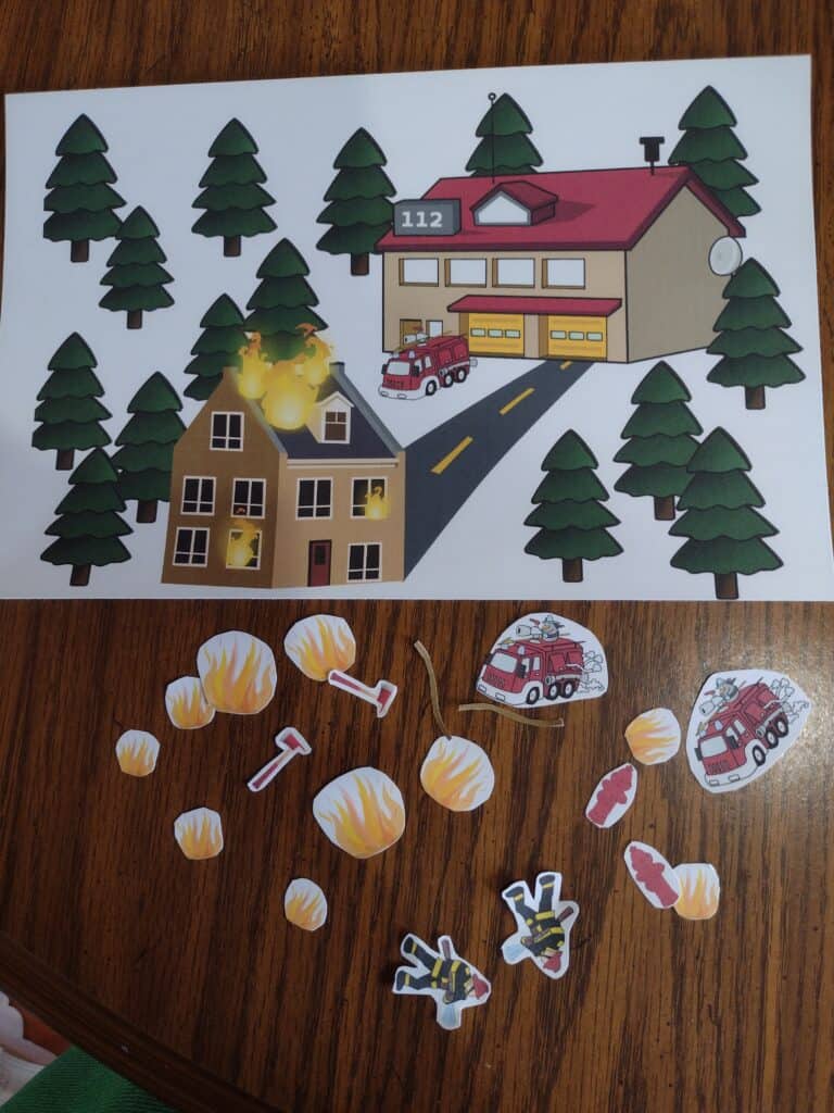 Picture of a firefighter themed background and small pieces cut out