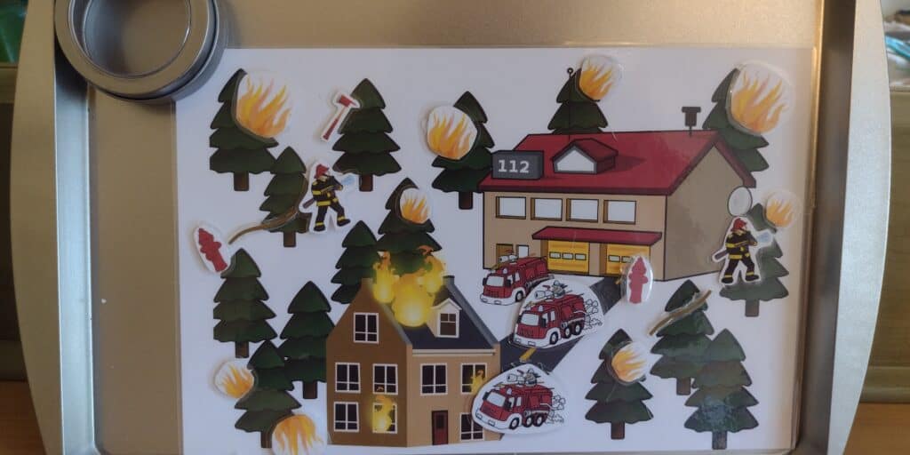 Picture of a firefighter play mat on a cookie sheet