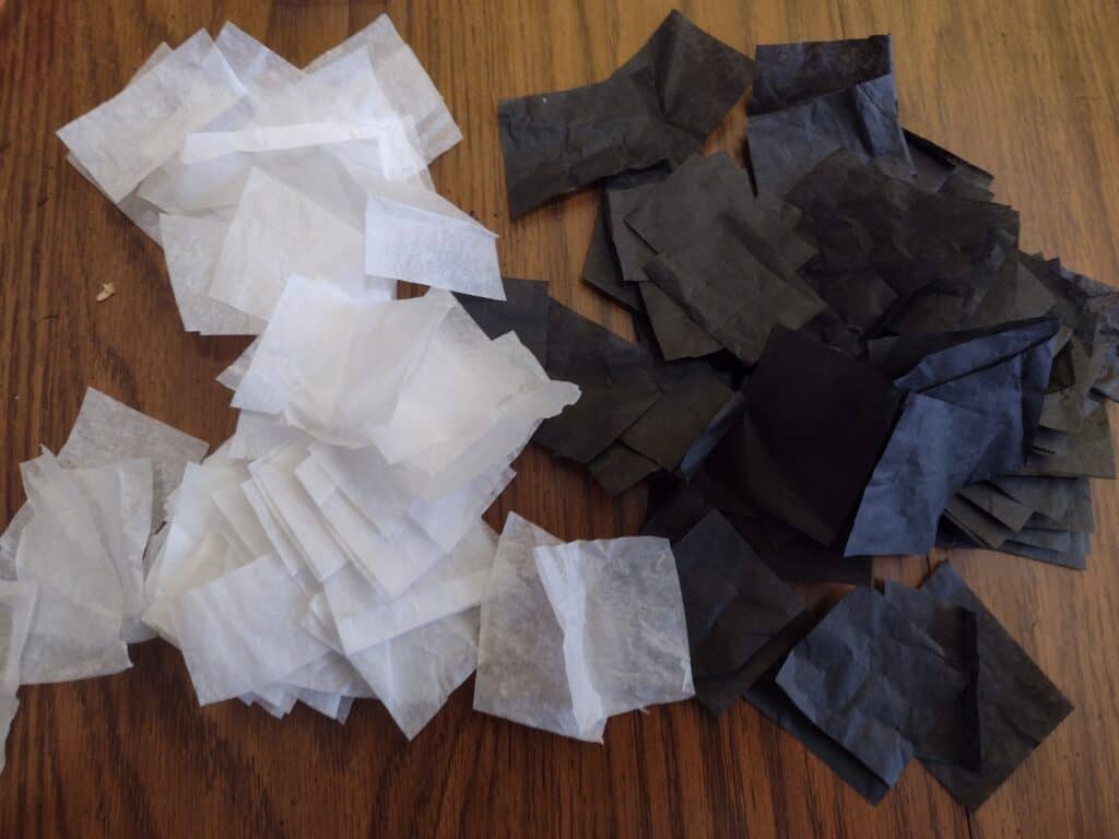 Picture of small squares of black and white tissue paper