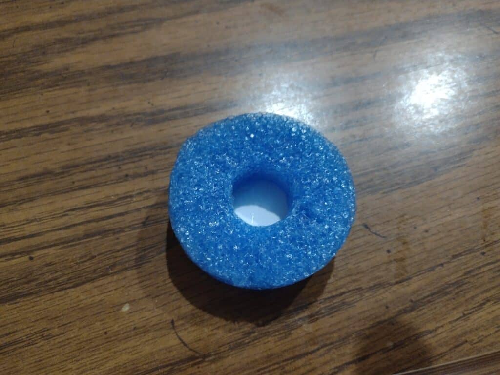 Picture of a pool noodle on top of a foam shape