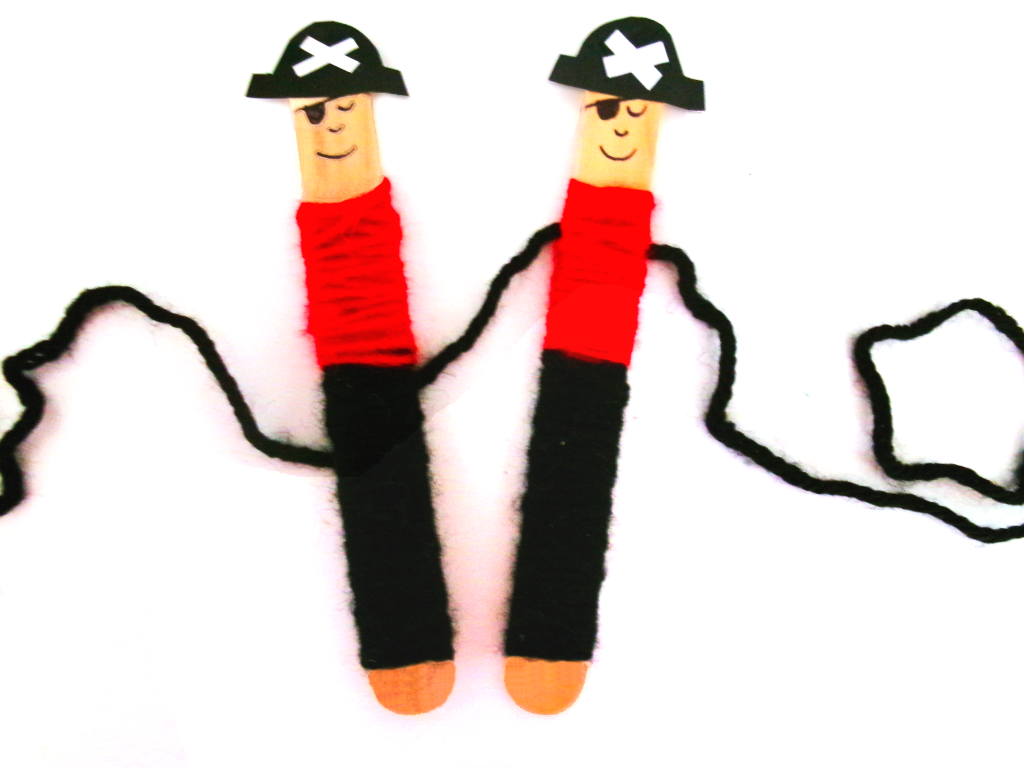 Picture of yarn wrapped around a popsicle stick to make it look like a pirate