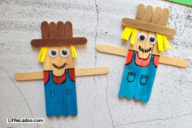 Picture of scarecrows made from popsicle sticks including little popsicle stick hats