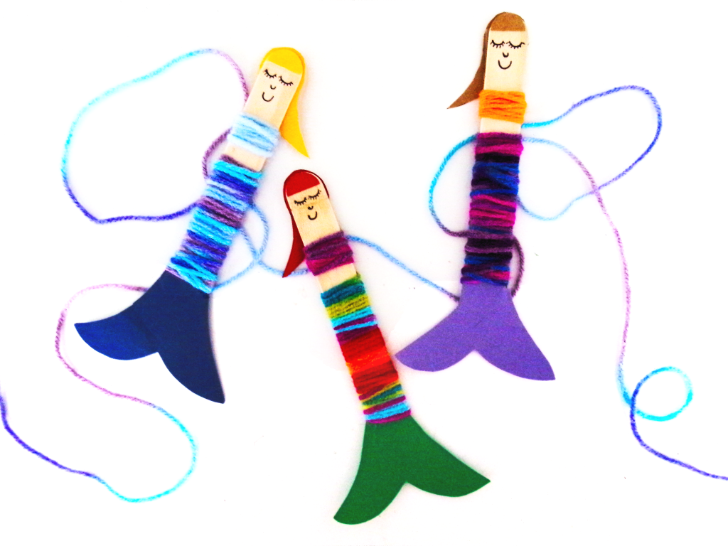 Picture of yarn wrapped a popsicle stick to make it look like a mermaid