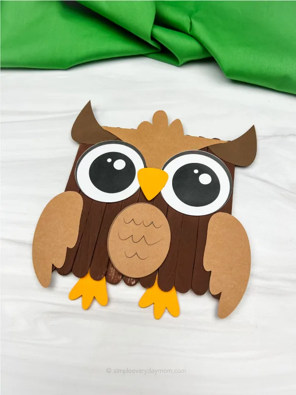 Owl craft with its body made from popsicle sticks