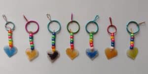 Picture of beaded keychains made by a preschooler with Shrinky Dink heart pendants