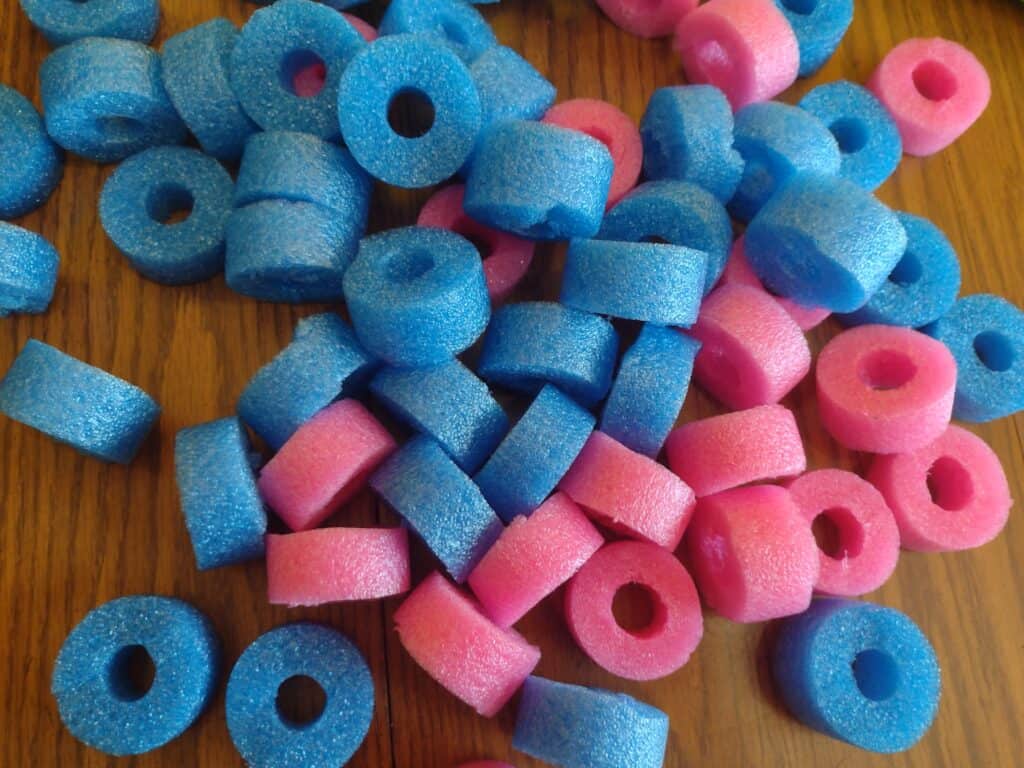 Picture of blue and pink pool noodles cut up