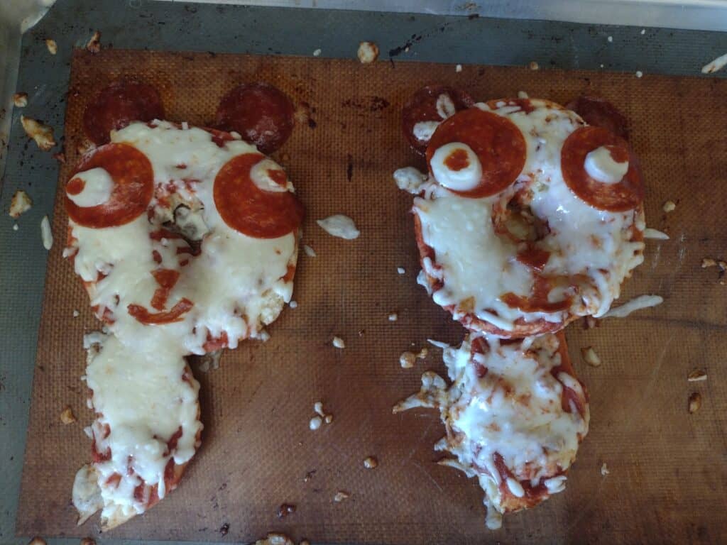 Picture of two pepperoni pizzas P is for panda craft after coming out of the oven