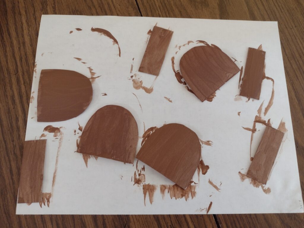 Picture of cardboard bear ear shapes painted brown