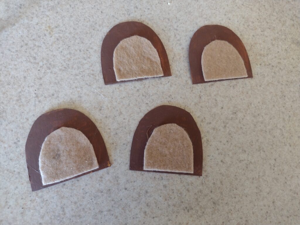 Picture of brown felt glued to painted brown cardboard to make bear ears